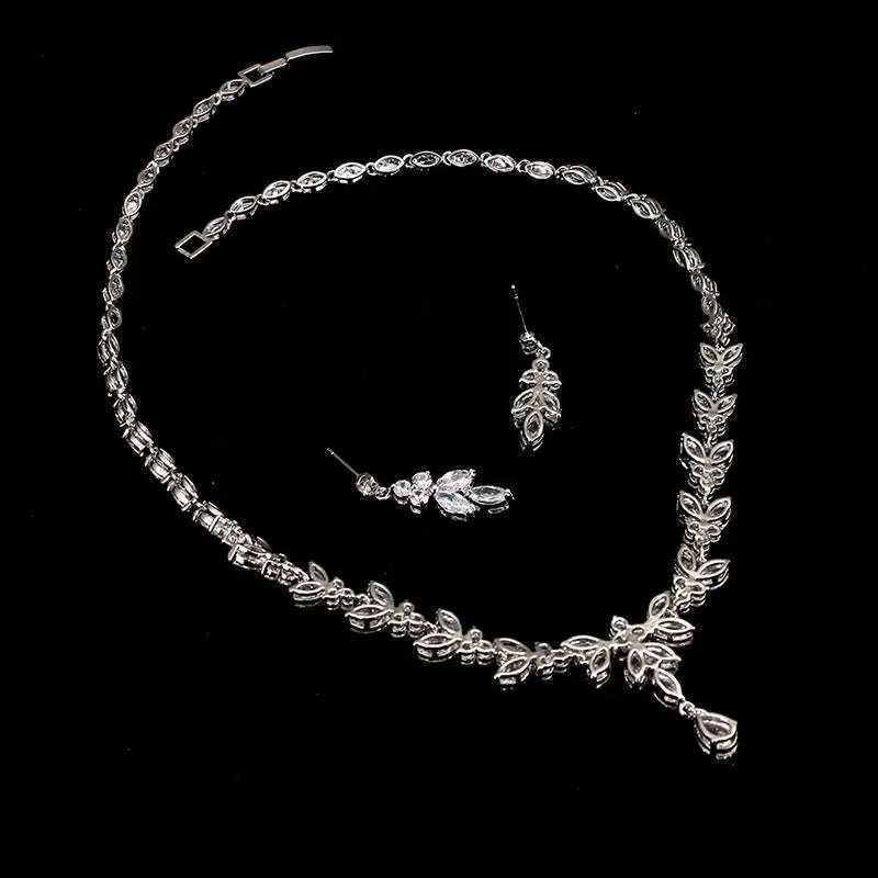 Silver leaf-patterned zircon simple bridal set featuring sparkling crystal accents and matching leaf crystal earrings